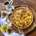 Passion fruit cheesecake decorated with white flowers, made at Indigo Vibe Cafe in Kilifi