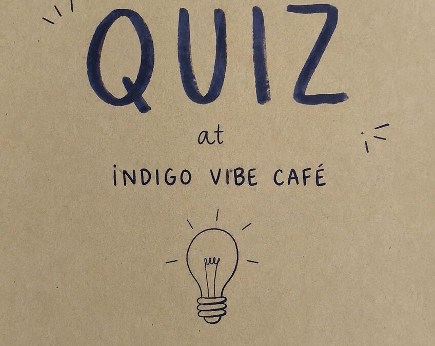 Hand-drawn poster announcing an upcoming quiz night at Indigo Vibe Cafe